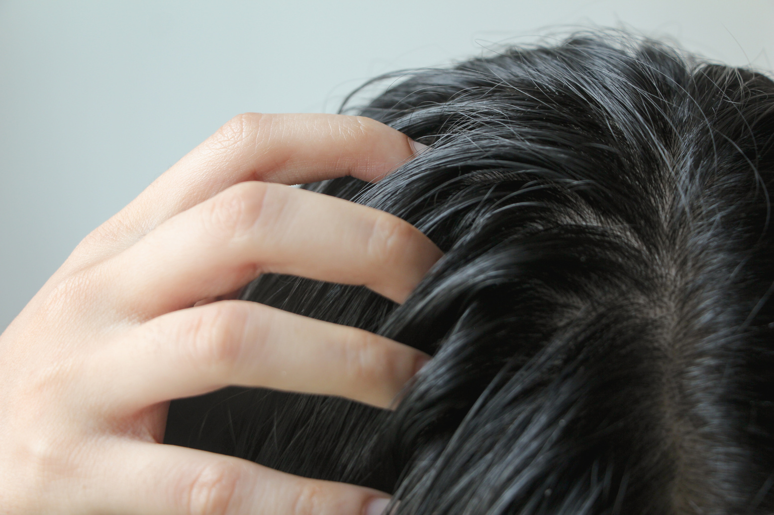 Close-up on head of Asian people have long black hair, having pr