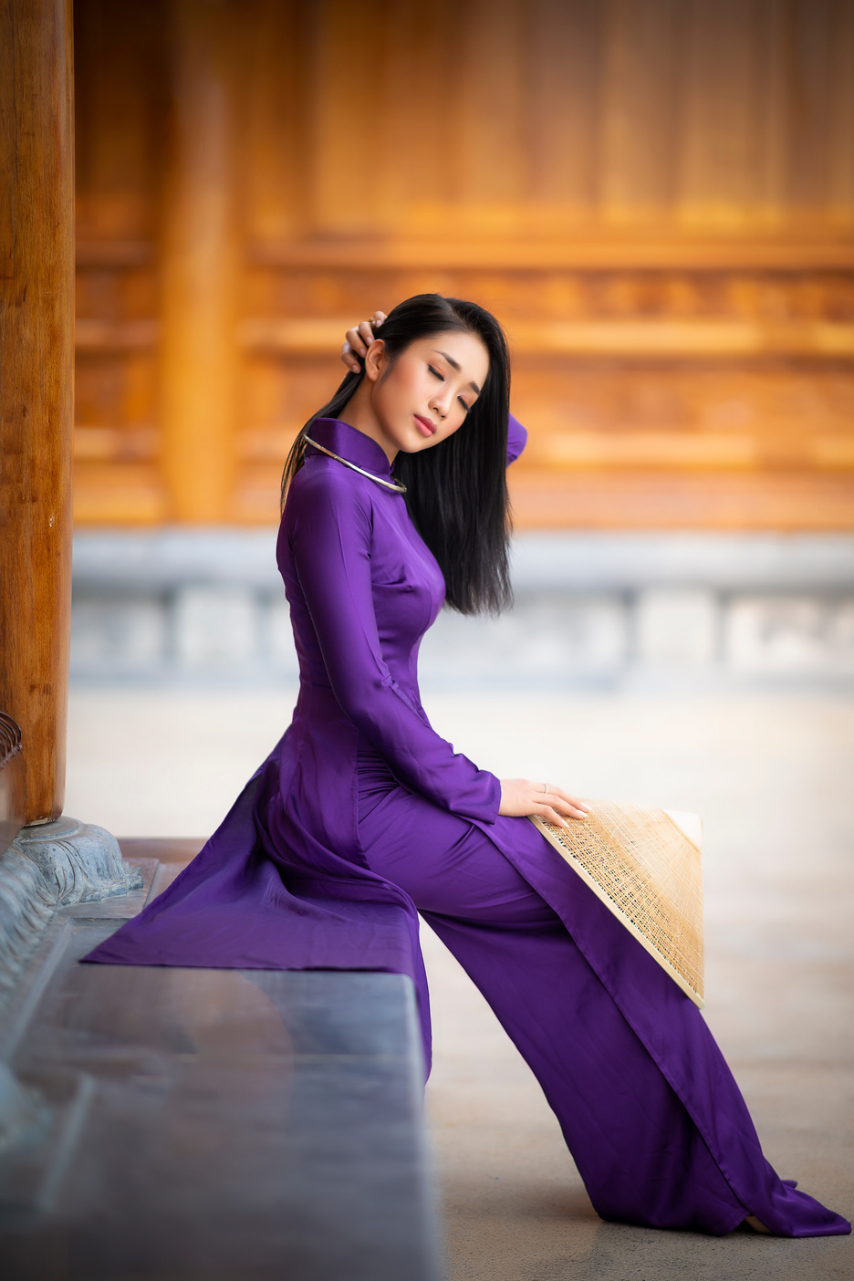 Woman in Purple Dress Sitting on Concrete Bench