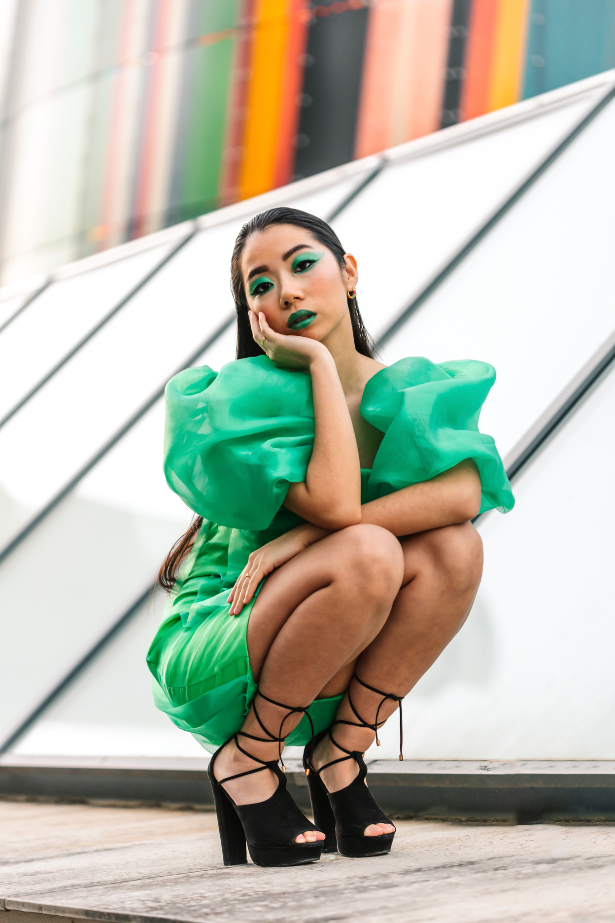 Beautiful Woman with Green Dress and Makeup