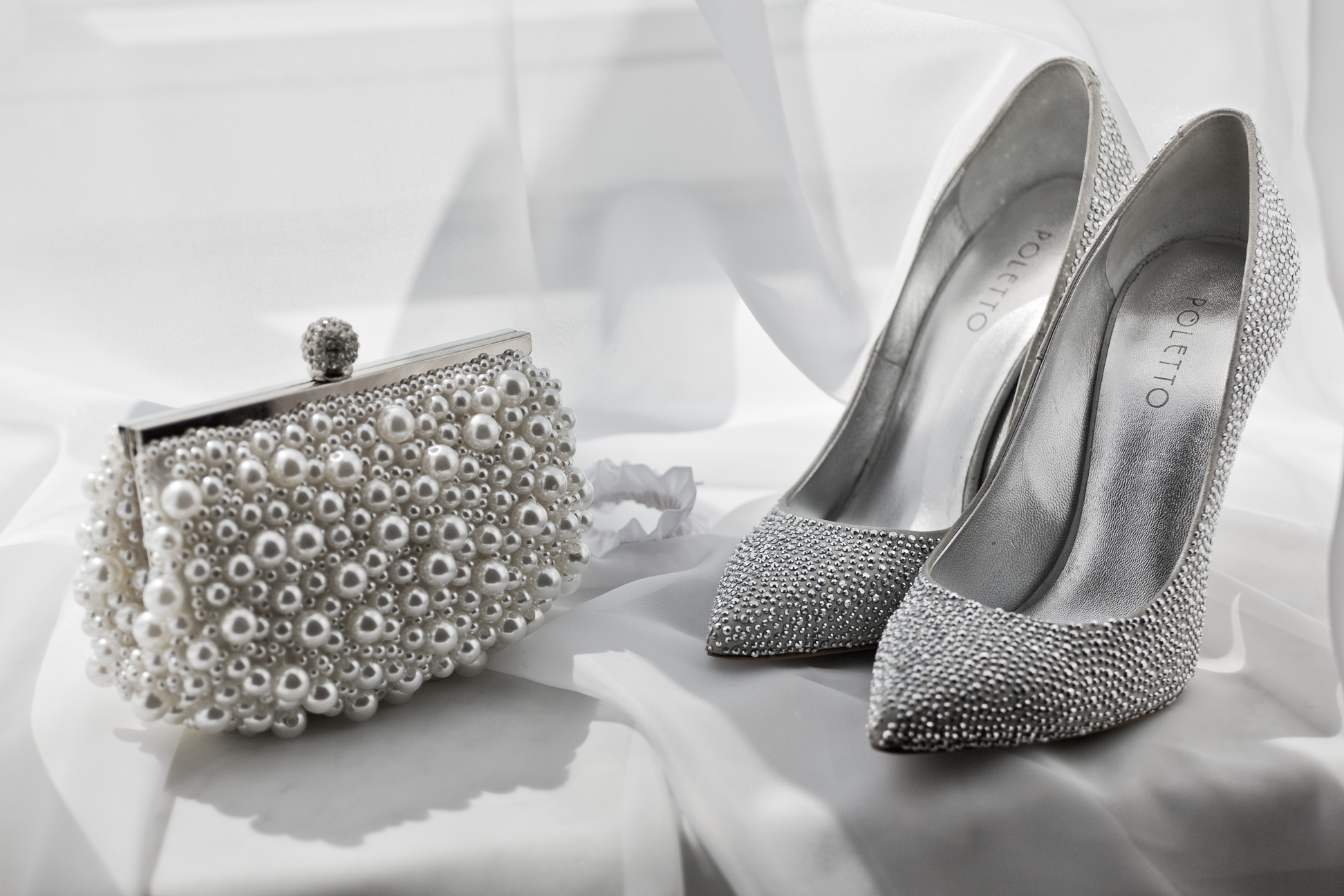 glitter silver shoes and clutch bag