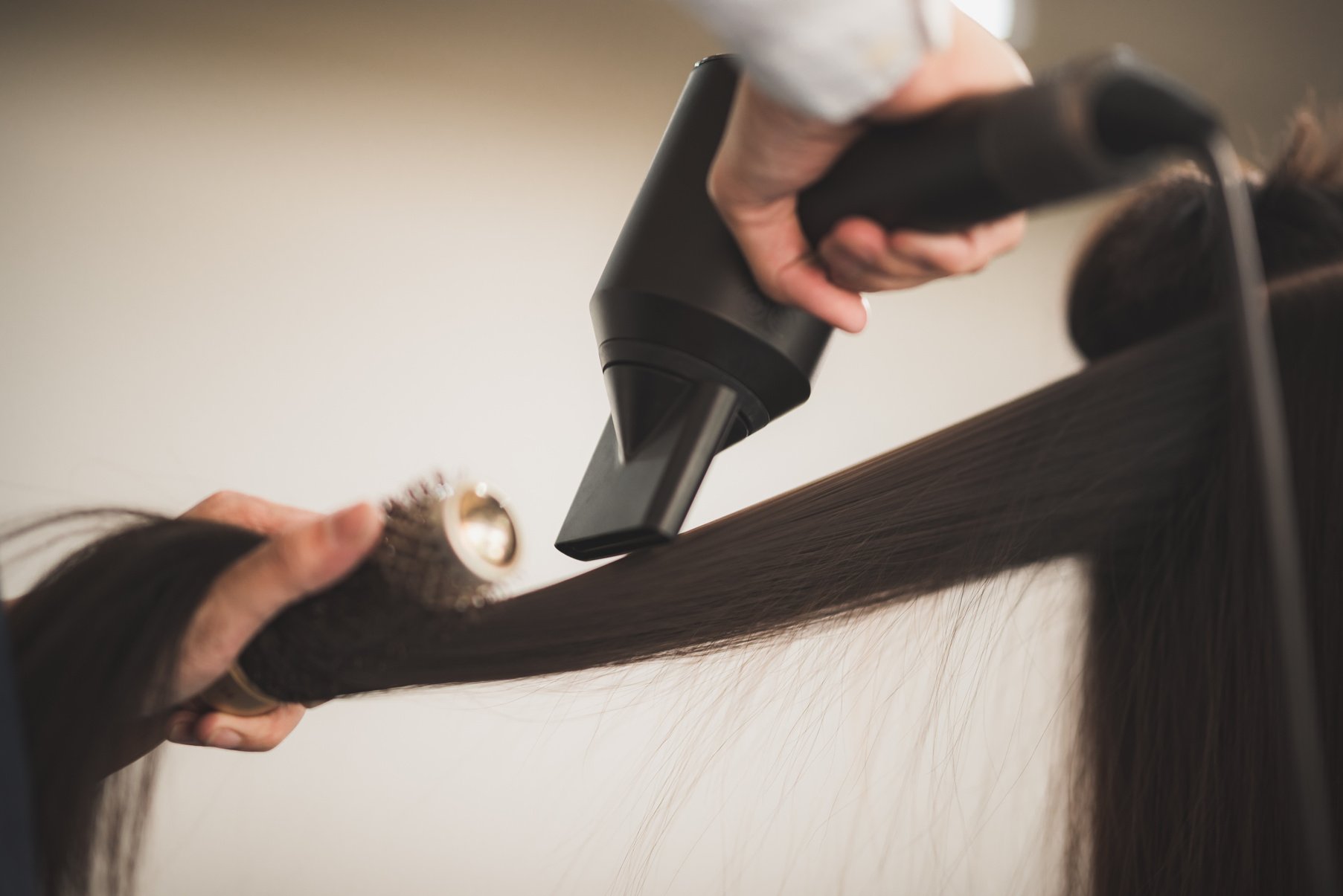 Young Hairstylist  Drying Hair and Blowdrying Hair of to Beautif